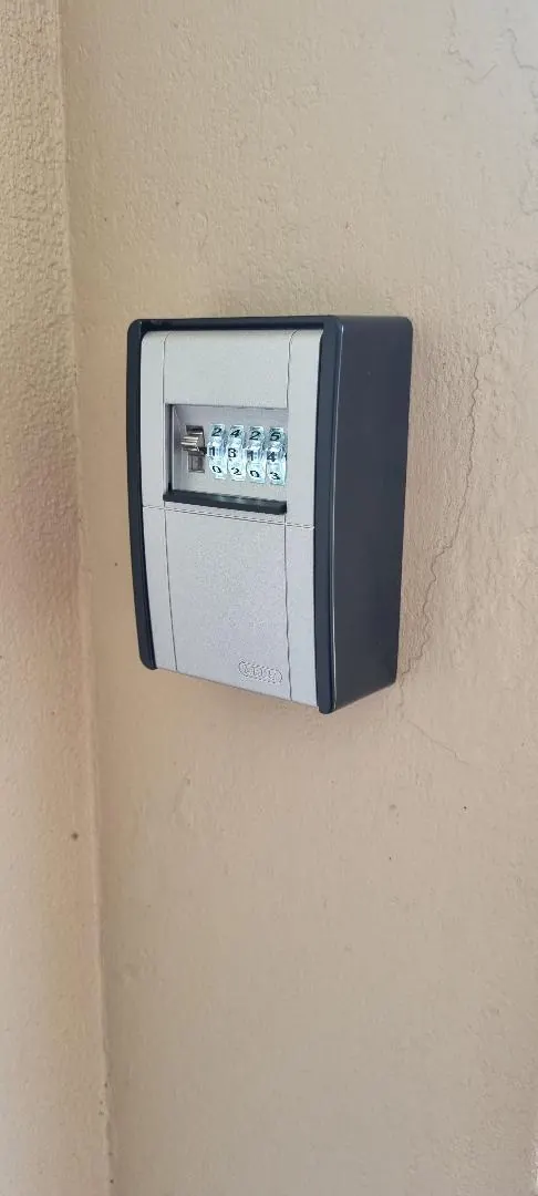 ABUS combination key safe lock box mounted on an exterior wall in Perth