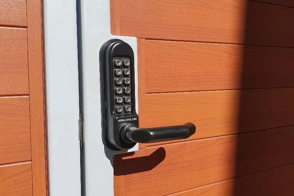 Weatherproof mechanical push-button keypad lock installed on a side gate in Perth