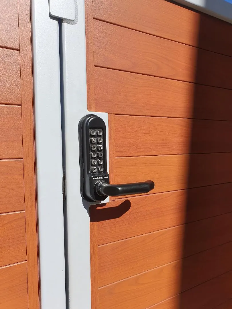 Weatherproof mechanical push-button keypad lock installed on a side gate in Perth
