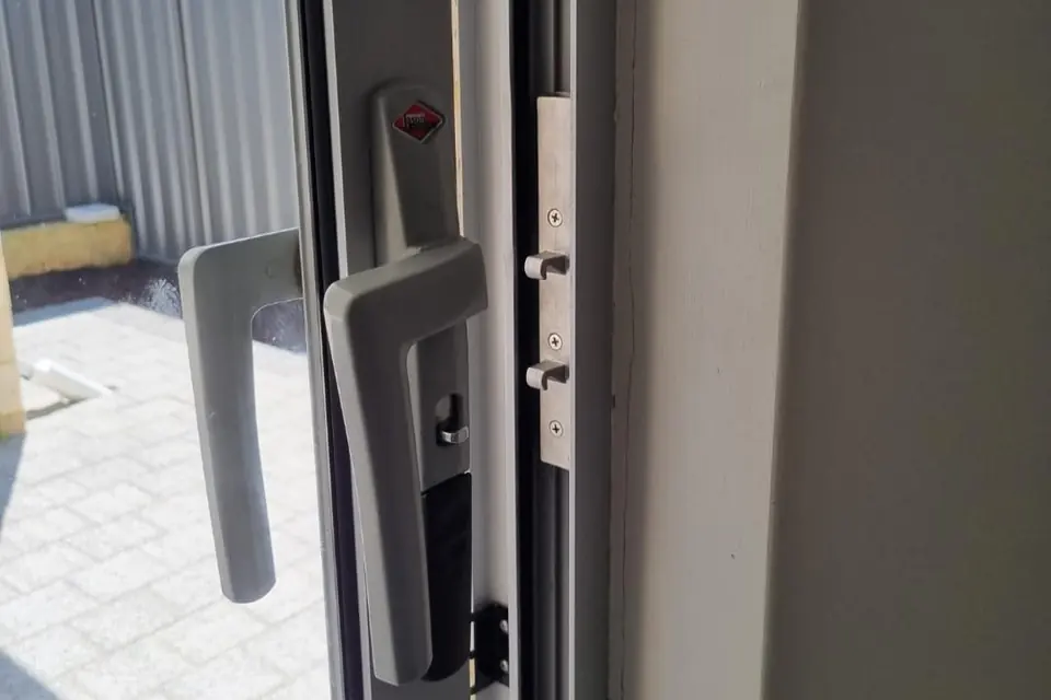 Multipoint lock and handle repaired on an aluminium hinged patio door in Perth
