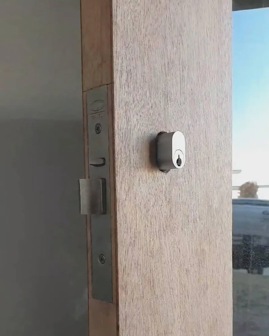 Mortice lock and key cylinder freshly installed in a solid timber entry door in Perth